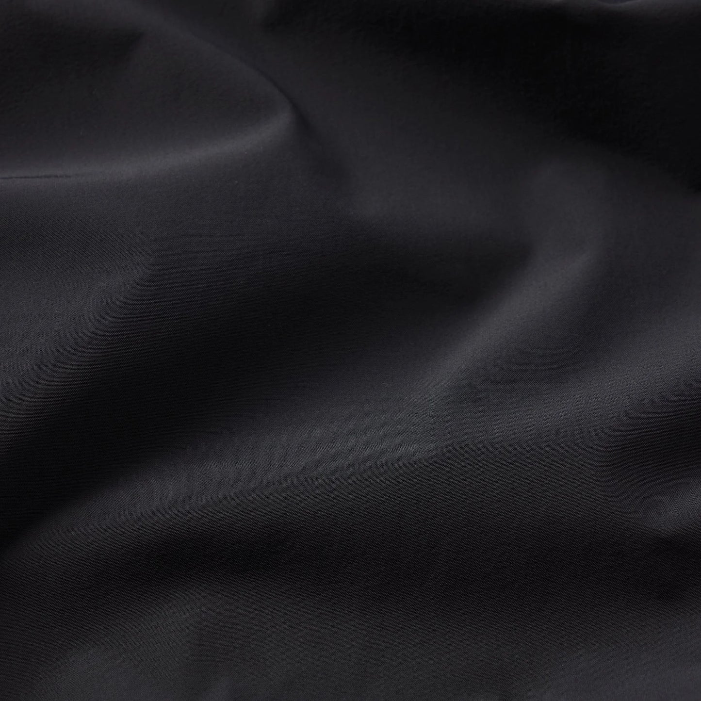 NikeSKIMS WOVEN NYLON OVERSIZED TRACK PANT | OBSIDIAN
