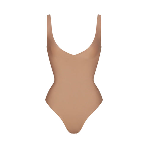 SKIMS BODY UNLINED PLUNGE THONG BODYSUIT | SIENNA