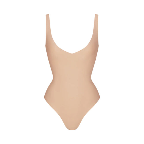 SKIMS BODY UNLINED PLUNGE THONG BODYSUIT | CLAY