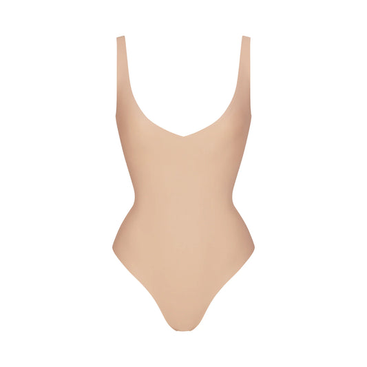 SKIMS BODY UNLINED PLUNGE THONG BODYSUIT | CLAY
