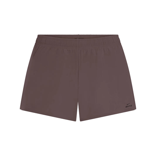 NikeSKIMS STRETCH NYLON RUNNER SHORT | RESIN