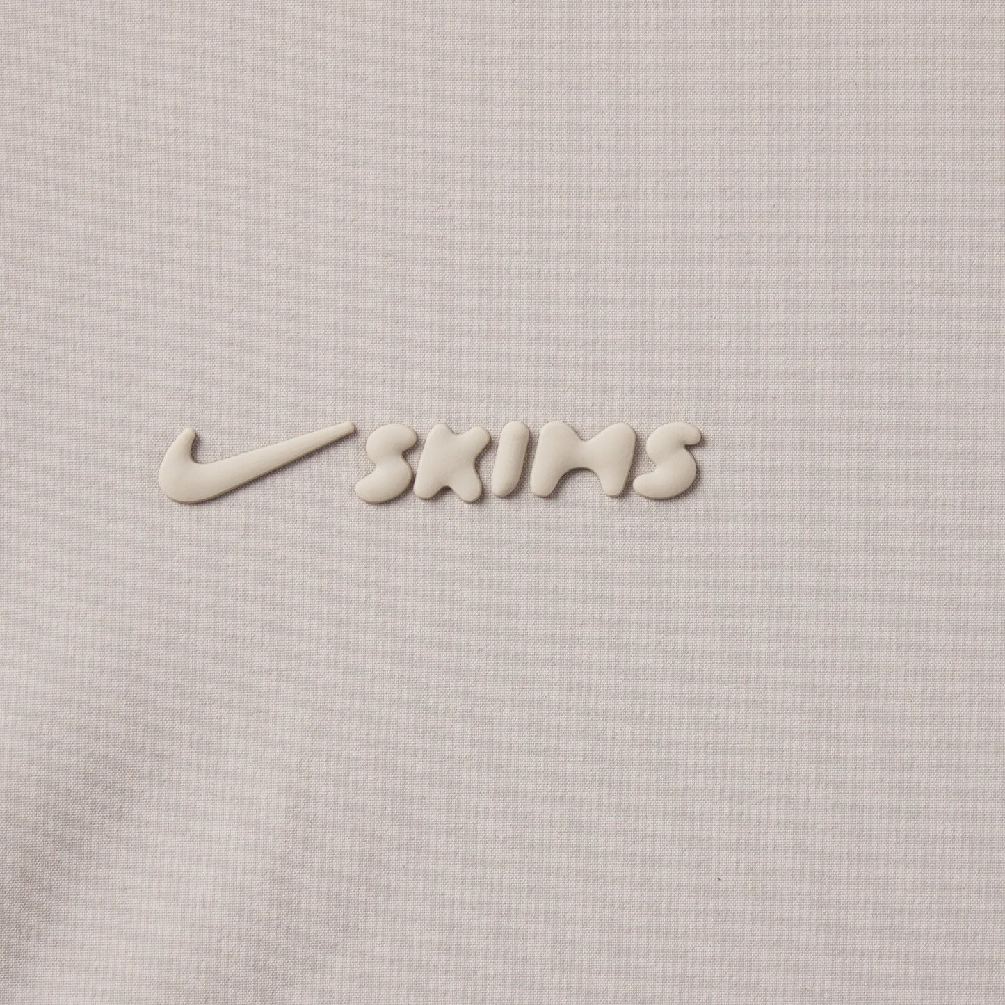 NikeSKIMS WOVEN NYLON 2.5" RUNNER SHORT | STONE