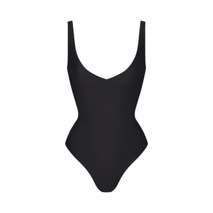 SKIMS BODY UNLINED PLUNGE THONG BODYSUIT | ONYX