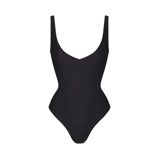 SKIMS BODY UNLINED PLUNGE THONG BODYSUIT | ONYX