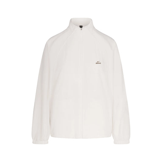 NikeSKIMS STRETCH NYLON OVERSIZED TRACK JACKET | IVORY