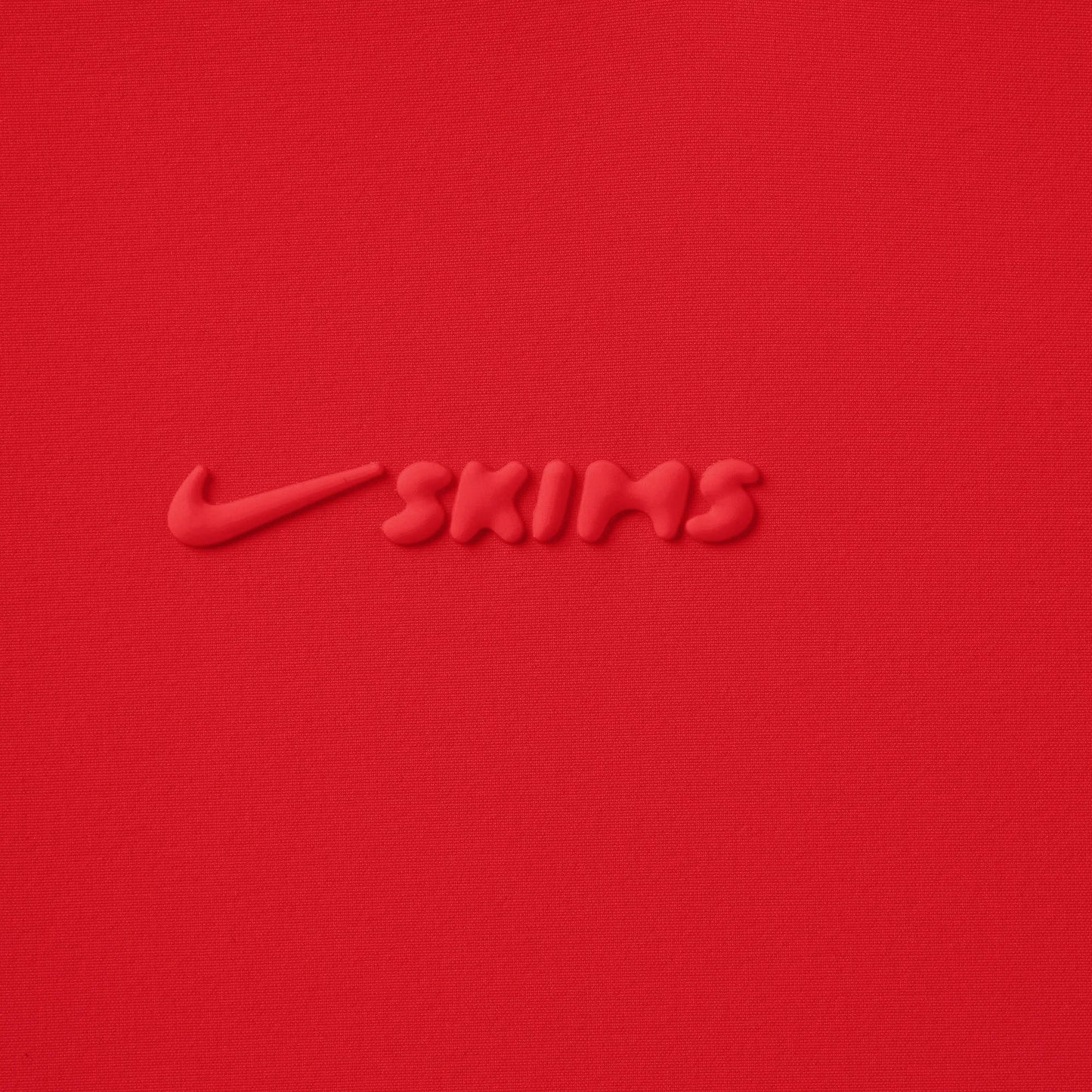 NikeSKIMS WOVEN NYLON 2.5" RUNNER SHORT | RUBY