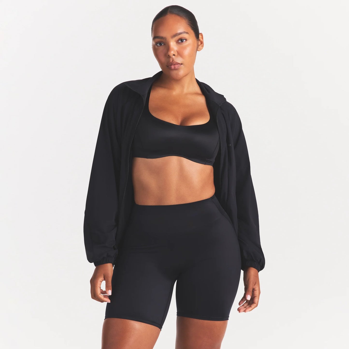 NikeSKIMS STRETCH NYLON OVERSIZED TRACK JACKET | OBSIDIAN