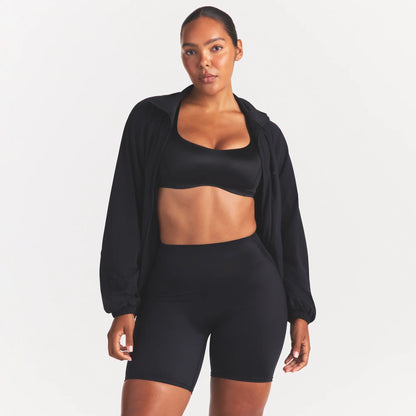 NikeSKIMS STRETCH NYLON OVERSIZED TRACK JACKET | OBSIDIAN
