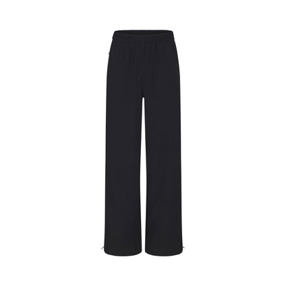 NikeSKIMS WOVEN NYLON OVERSIZED TRACK PANT | OBSIDIAN