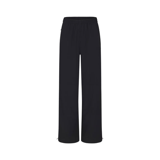 NikeSKIMS WOVEN NYLON OVERSIZED TRACK PANT | OBSIDIAN