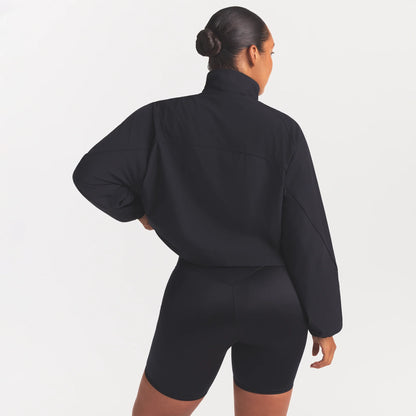 NikeSKIMS STRETCH NYLON OVERSIZED TRACK JACKET | OBSIDIAN