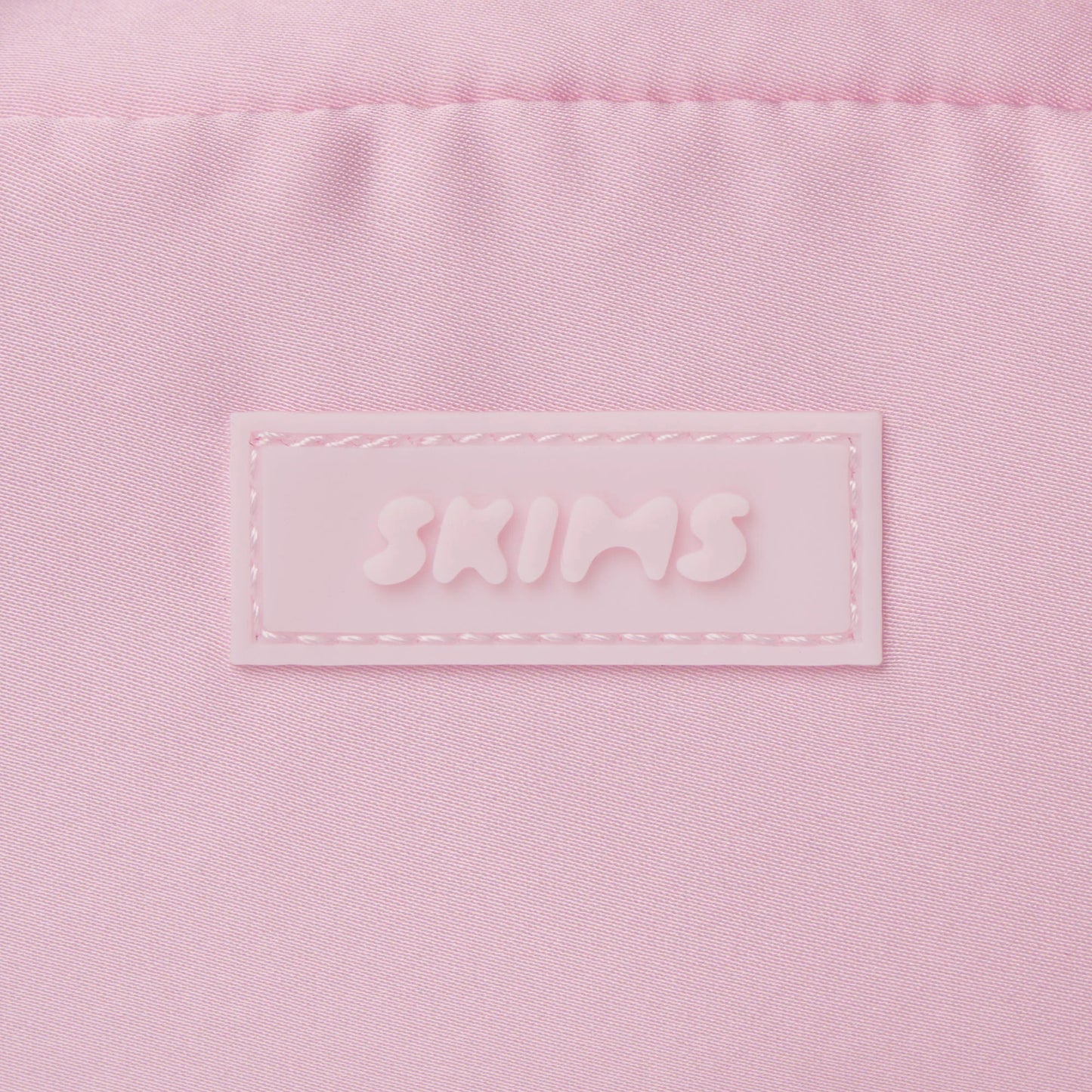 SKIMS ACCESSORIES SATIN MINI DUFFLE BAG | PEONY